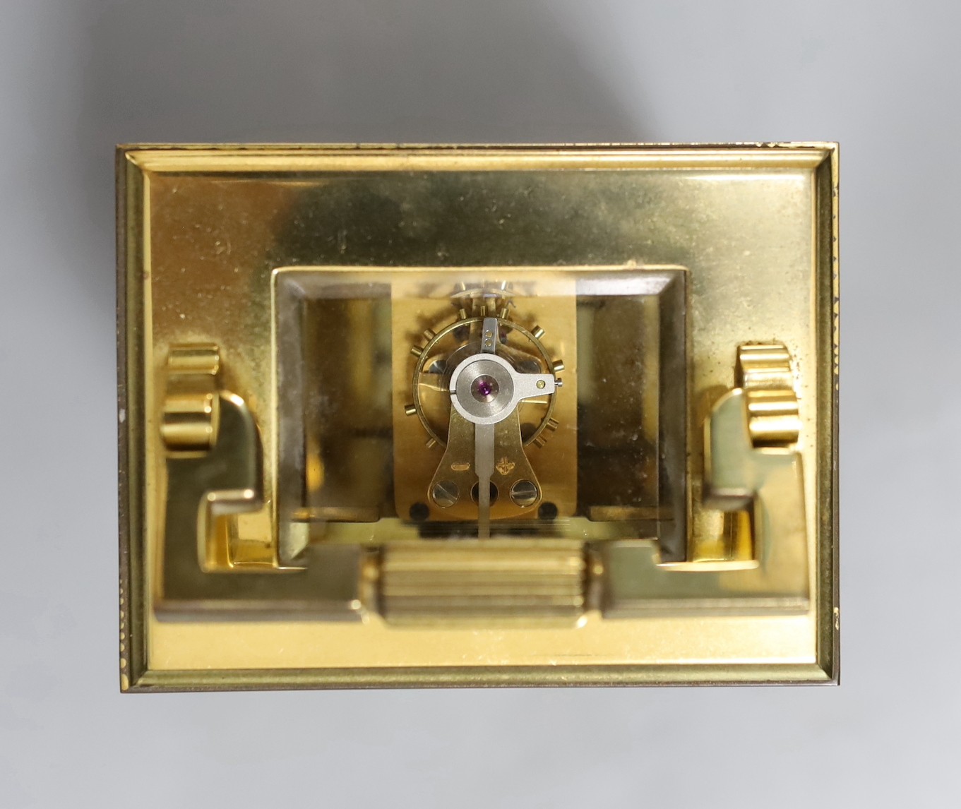 A French brass carriage timepiece, Mappin & Webb, 11.5 cms high.